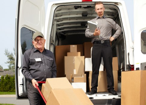 Employee following safe handling practices in a storage area