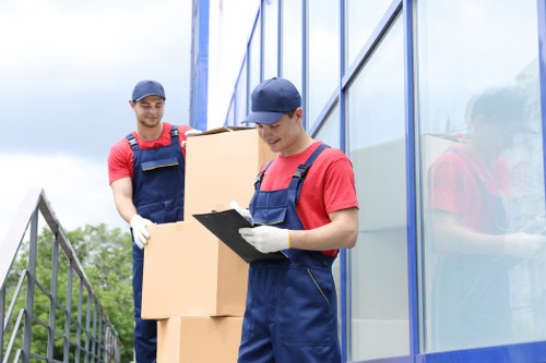 Customer placing items into a secure storage unit at Falconwood Storage
