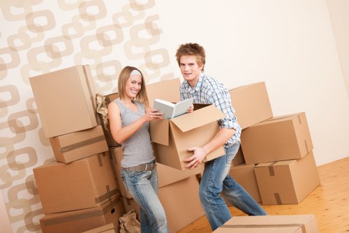 Packed office boxes and furniture ready for relocation in Falconwood