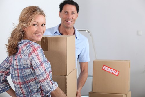 Professional movers handling furniture during a Falconwood move